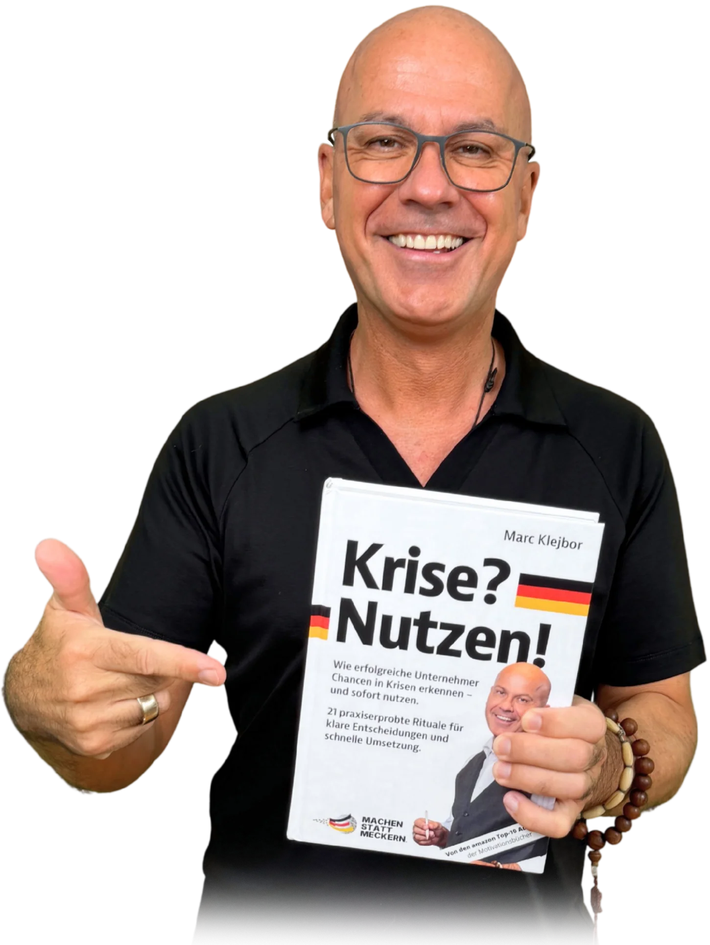 Marc Klejbor zeigt auf sein Buch „Krise? Nutzen!“, Einladung zum kostenlosen Live-Webinar über die drei Rollen des Geschäftsführers am 17. September 2026.